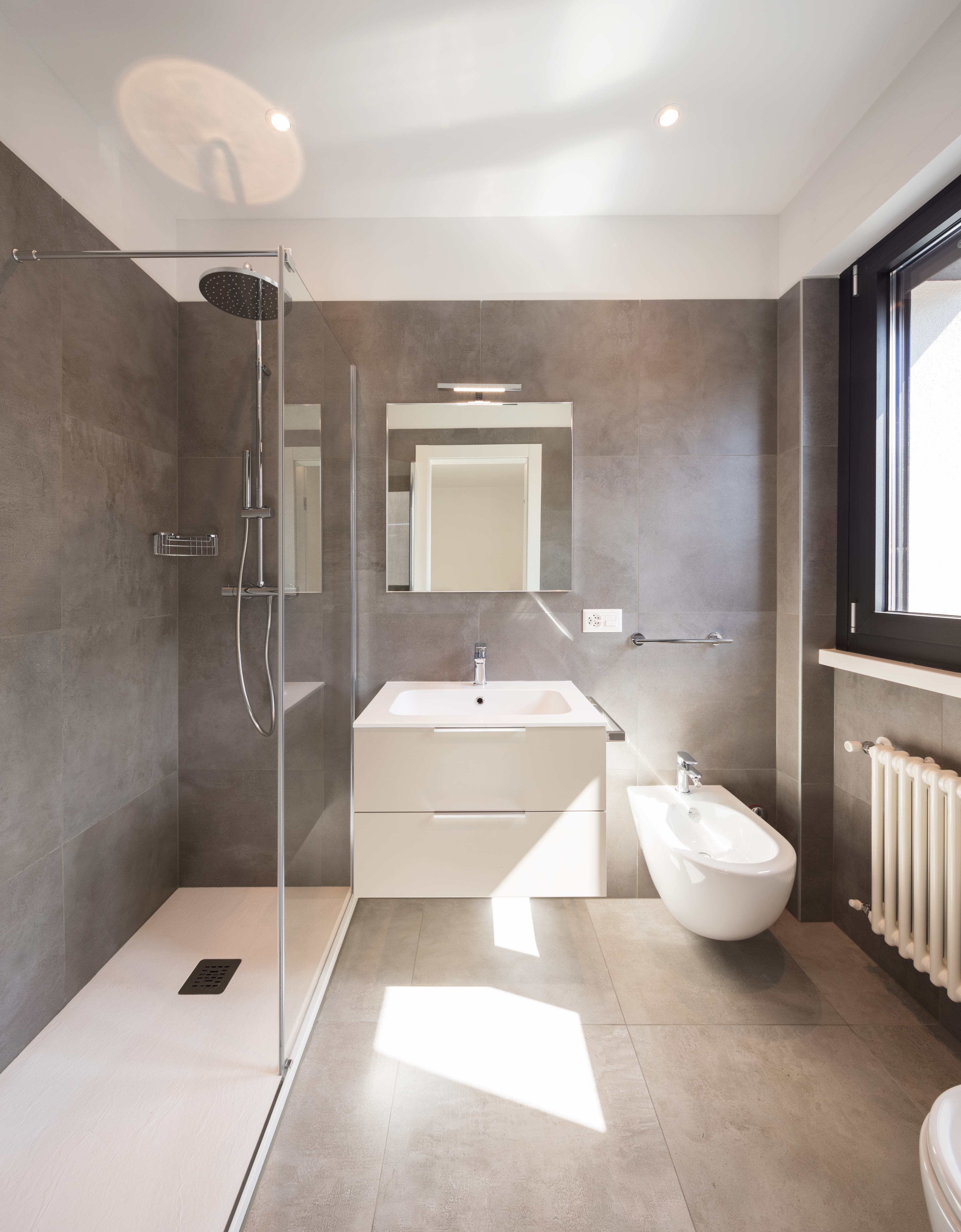 Modern bathroom with large tiles.